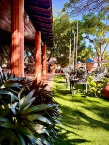 a porch of a house with chairs and plants at BUENAVISTA INN in Maiquetía