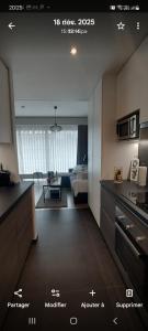 a view of a kitchen and a living room at Studio Belle-Vue in Spa