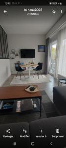 a living room with a couch and a table at Studio Belle-Vue in Spa