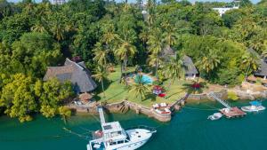 an aerial view of a boat in the water at The Garden Suite in Mtwapa