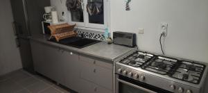 a kitchen with a stove and a counter top at Studio Paisible in Nouzilly +5 photos
