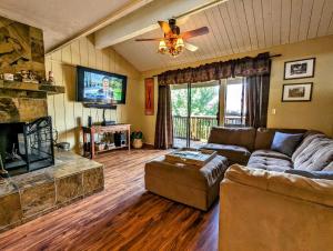 a living room with a couch and a fireplace at Snow Summit Townhouse Unit 69 in Big Bear Lake
