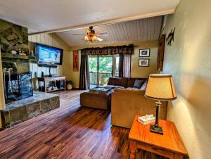 a living room with a couch and a table at Snow Summit Townhouse Unit 69 in Big Bear Lake