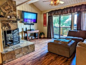 a living room with a couch and a fireplace at Snow Summit Townhouse Unit 69 in Big Bear Lake