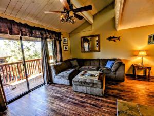 a living room with a couch and a table at Snow Summit Townhouse Unit 69 in Big Bear Lake +22 photos