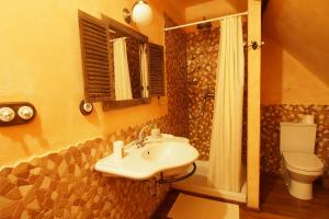 a bathroom with a sink and a toilet at Apartmány Reve in Třeboň +42 photos