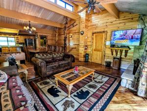a living room with a couch and a table at Snow Summit Townhouse Unit 52 in Big Bear Lake