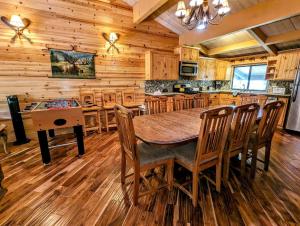 a dining room and kitchen with a table and chairs at Snow Summit Townhouse Unit 52 in Big Bear Lake
