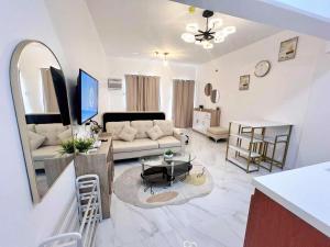 a living room with a couch and a table at AJB Royal Ocean Crest Mactan Cebu in Cebu City