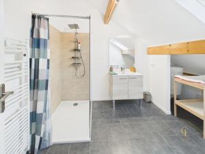 a bathroom with a shower and a sink at Cozy chalet with Nordic bath in Plancher-Bas +34 photos