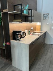 a kitchen with a sink and a counter top at Nieznany Bór 8 in Hajnówka +1 photo
