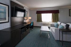 a hotel room with a couch and a living room at Symphony Inn in San Francisco