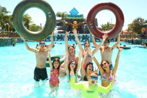 a group of people in the water at a swimming pool at Caverá Country Park in Araranguá +1 photo