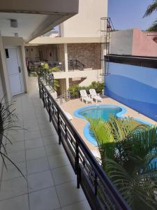 a patio with a swimming pool on a building at Hotel Suite y SPA VerdeSolaro in Villa Elisa