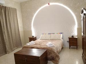 a bedroom with a bed with an arch overhead at Bred breakfast D&D in Augusta +6 photos