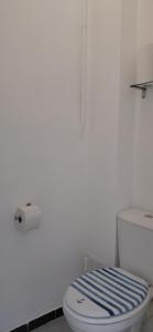 a white bathroom with a blue and white toilet at Appartement Le Cap in Toulon +13 photos