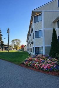 a building with a flower bed in front of it at Park Inn in Colchester