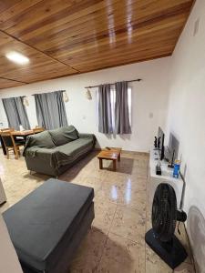 a living room with a couch and a table at La Faustina in Chajarí