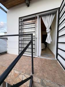 a sliding glass door on a house with a window at La Faustina in Chajarí