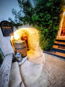 a barrel sitting in front of a building at Spa et Sauna Le Roosevelt in Château-Thierry