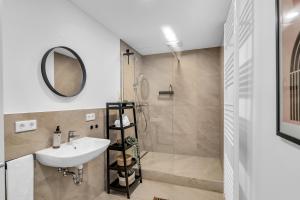 a bathroom with a sink and a shower at INhome - Zentral - Küche - Modern in Schwäbisch Hall +21 photos