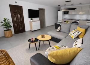 a living room with a couch and a table at Villa Sotavento Modern new apartment in Park Natural Adults Only in Playa Jandia