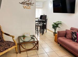 a living room with a couch and a table at Casa Natalia Welcome in La Paz