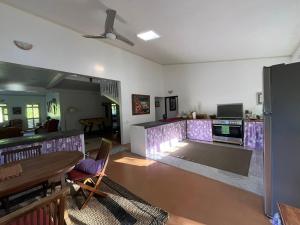 a living room with a fire pit in the middle at Waterlily House in HUH