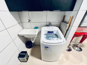 a small bathroom with a toilet and a sink at Residencial Mª Do Bonfim - 5km Aeroporto JK in Brasília +30 photos
