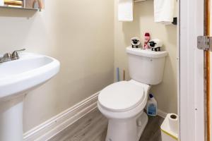 a bathroom with a toilet and a sink at Spacious 2BR Apt • Free Parking • Baden in Baden
