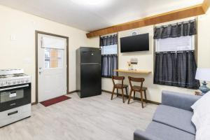 a living room with a couch and a kitchen at Spacious 2BR Apt • Free Parking • Baden in Baden +14 photos