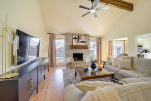 a living room with a couch and a fireplace at Groups Welcome, Central Location! Tulsa Gem + Yard in Tulsa