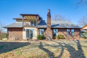 a brick house with a chimney on top of it at Groups Welcome, Central Location! Tulsa Gem + Yard in Tulsa