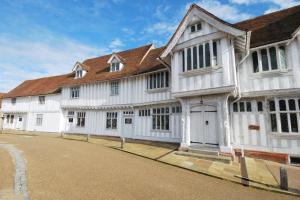 a large white building with a brown roof at 3 Bed in Great Waldingfield oc-ac2 in Waldingfield