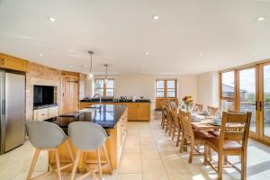 a kitchen with a long dining table and chairs at 5 Bed in Langport oc-h33495 in Langport