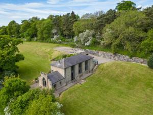 an aerial view of an old stone building in a field at 3 Bed in Richmond oc-86747 in Gilling