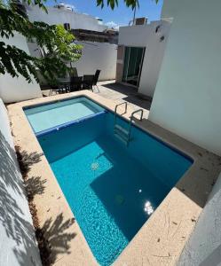 a swimming pool in the backyard of a house at Casa Toreo in Mazatlán