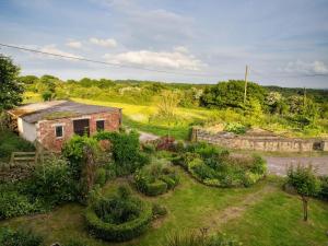 an aerial view of a garden with a brick house at 2 Bed in Holmesfield oc-pk783 in Dronfield