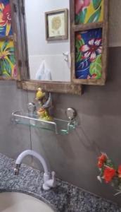 a bathroom counter with a sink and a mirror at Estância Jockey Clube in Sao Jose do Rio Preto +50 photos