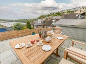 a wooden table on the roof of a house at 2 Bed in Fowey oc-91396 in Fowey
