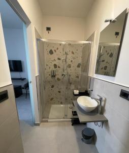 a bathroom with a shower and a sink at Domus de janas 2 in Alghero +40 photos