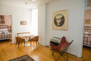 a living room with a table and chairs at Object Hotel 2BR Room 2G in Bisbee