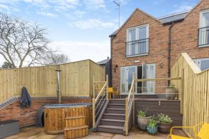 a home with a wooden fence and a patio at 1 Bed in Pershore oc-t29051 in Pershore