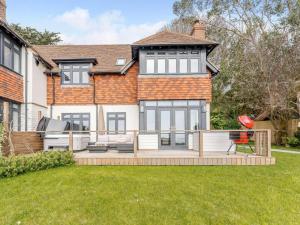 a house with a large deck in the yard at 3 Bed in Hythe oc-87167 in Hythe