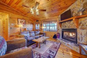 a living room with a couch and a fireplace at Amy’s Blue Ridge Mtn & Starlight View in Ellijay