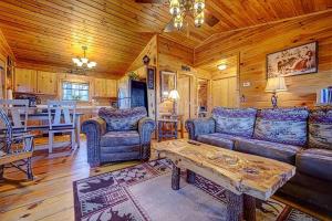 a living room with a couch and a table at Amy’s Blue Ridge Mtn & Starlight View in Ellijay