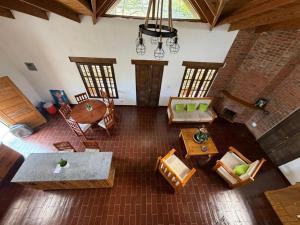 an overhead view of a living room with tables and chairs at Villa Ana Rosa in Jarabacoa