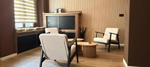 a dining room with two chairs and a table at Marina Boutique in Valencia +159 photos
