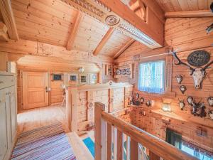 a log cabin with wooden walls and ceilings at Poschen in Wald im Pinzgau