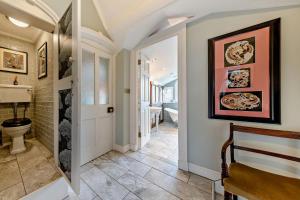 a hallway with a bathroom with a toilet at 3 Bed in Ruthin oc-a29313 in Ruthin +31 photos